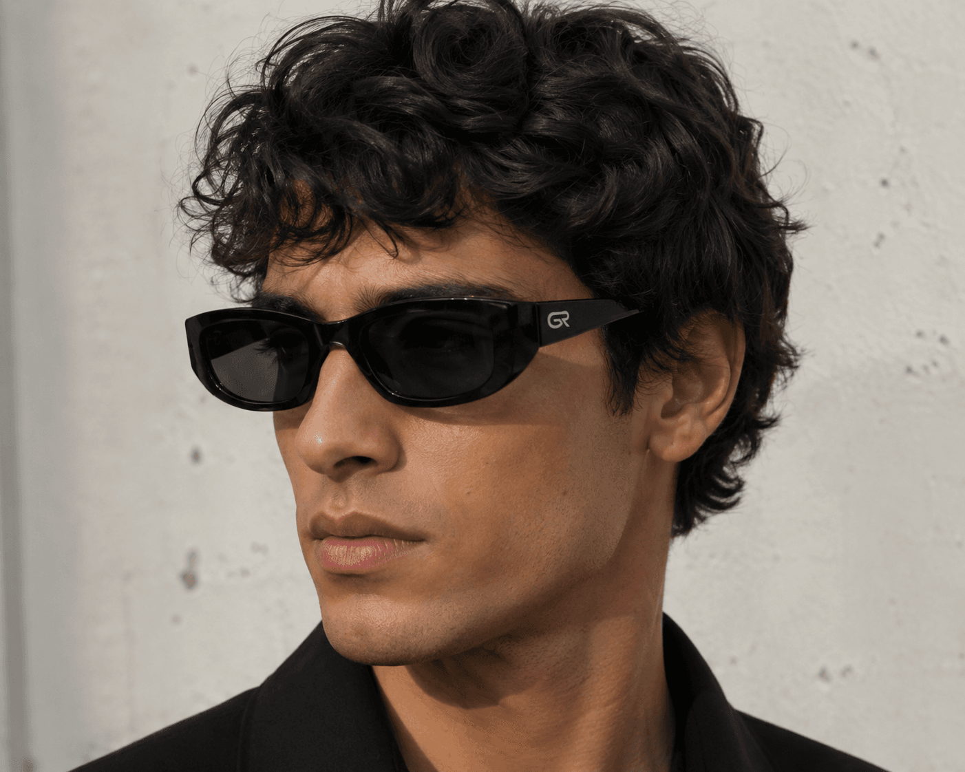 Man wearing black GR sunglasses